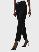 Close-up of black slim fit stretch jeans, illustrating the fabric texture and stylish silhouette.