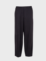 Black barrel trousers made from supersoft material, designed for comfort and a relaxed silhouette.