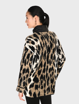 Black and tan leopard print knit jacket made from soft, lightweight fabric, displayed on a neutral background.