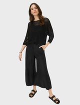 Soft, lightweight black wide leg trousers designed for comfort and ease of movement.