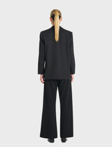 Stylish black utility blazer with a fitted cut and multiple pockets, suitable for various occasions.