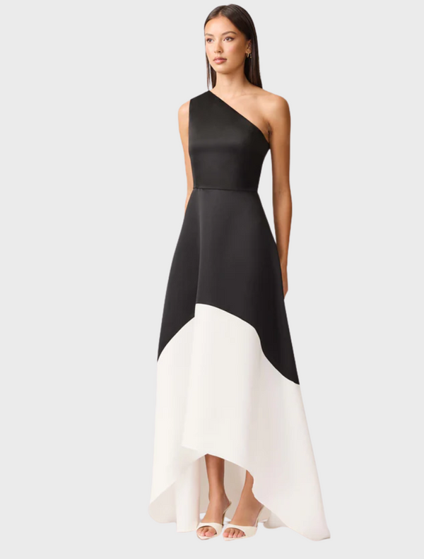 The dress features a unique black and white pattern, made entirely from one continuous piece of fabric.