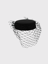 Elegant black Zahra Pillbox Hat with structured design and veiling, ideal for race day or formal occasions by Morgan & Taylor.