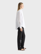 A pair of black Zip Cargo pants shown, highlighting their practical pockets and modern fit against a neutral backdrop.