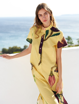 A model wearing a yellow Blance shirt dress, demonstrating its stylish cut and casual elegance.