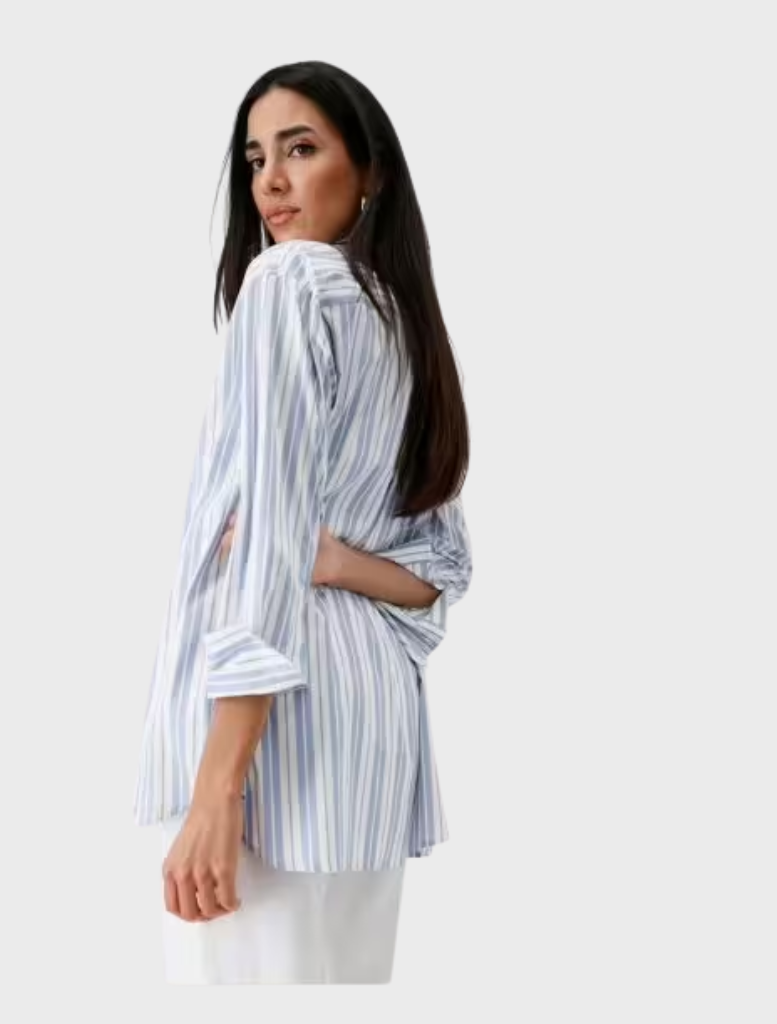 Stylish women's shirt featuring blue and white stripes and a collar, ideal for both work and leisure activities.