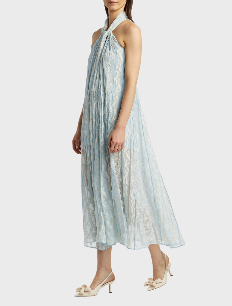 Elegant aqua Luana Dress draped on a hanger, emphasizing its lightweight material and chic design.