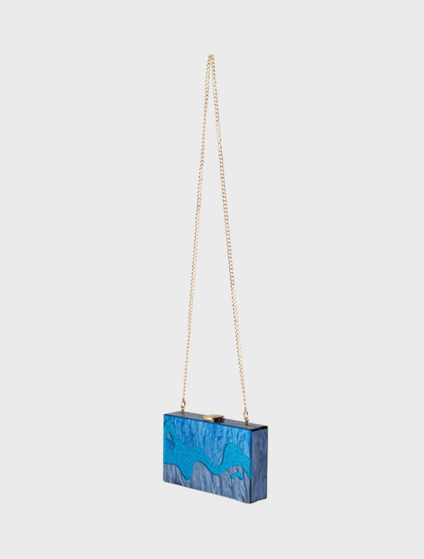  chic blue and white purse with a chain strap, perfect for adding a pop of color to any outfit.