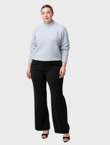 Blue Frost Savanna Alpaca Blend Sweater displayed on a hanger, showcasing its soft texture and elegant design