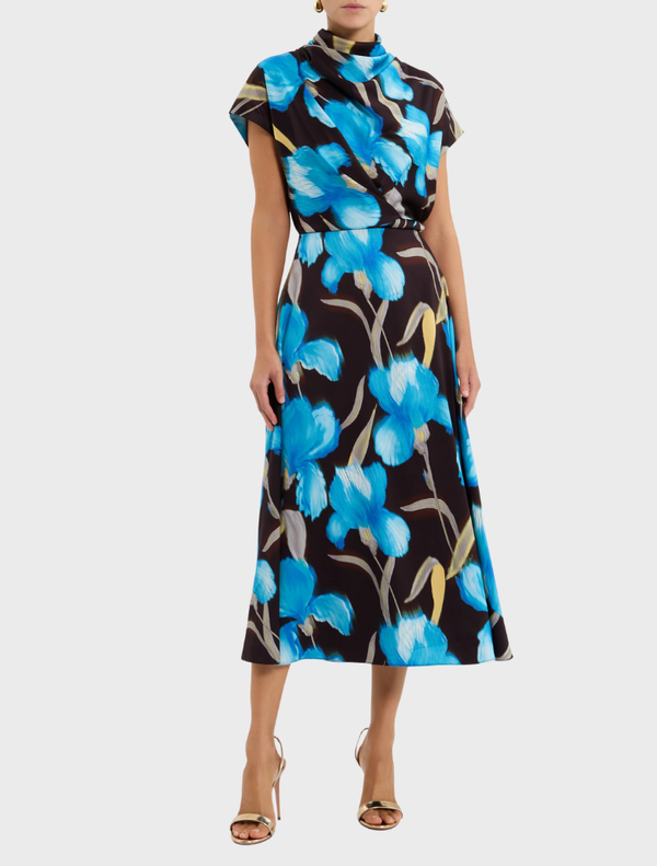 Ingrid midi dress in blue iris floral print, showcasing a stylish design with a fitted top and a flowing skirt for elegance.
