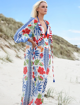A stylish blue multi dress featuring a vibrant pattern, ideal for warm weather occasions and gatherings.