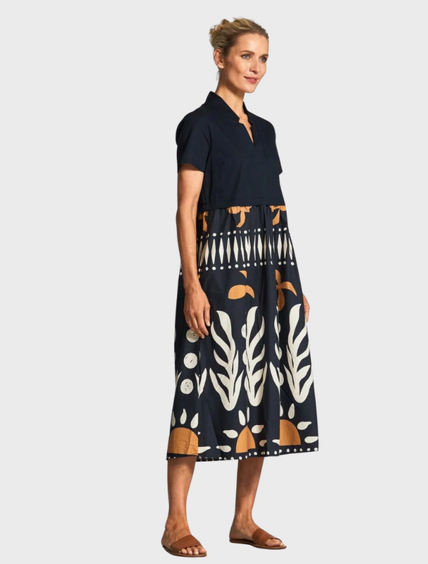 A stylish black and white dress adorned with a unique pattern, perfect for various occasions.