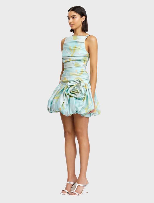 Stylish blue plum mini dress adorned with a forest pattern, designed with short sleeves and a flattering fit for everyday wear.