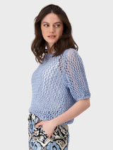 Stylish blue sky pullover with a boat neck and ajour rib design, suitable for various occasions.