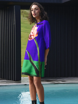 Elegant Shift Code dress in blue with tulip print, perfect for spring events or casual outings.