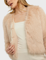 Soft blush faux fur jacket, designed for comfort and style, perfect for layering in cooler weather.