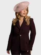 Elegant blush pink fascinator with a structured base and sheer detailing, perfect for racewear and formal occasions.