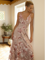 Blush-pink Elena Midi dress, showcasing a graceful cut and soft fabric, perfect for formal or casual events.