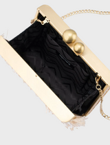 The Carlita Fringe Clutch in natural features a chic design with white fringe, perfect for adding flair to any outfit.