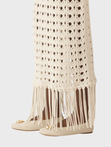 Stylish off-white fringed knit skirt, combining texture and elegance for a fashionable wardrobe addition.
