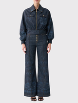 Denim bomber jacket featuring pockets, ribbed cuffs, and crystal embellishments for a stylish, utilitarian look.
