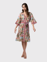 Knee-length dress with decorative floaty sleeves, contrast placket, waist tie, and tucks at the neckline for enhanced volume.
