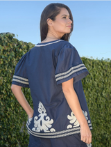 Close-up of a blue Border Control Top, emphasizing its color and design details.