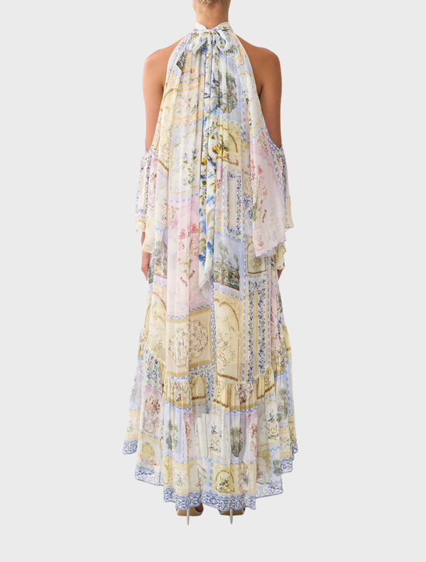 Elegant cold shoulder long dress adorned with a vibrant botanical pattern, ideal for summer gatherings and formal events.