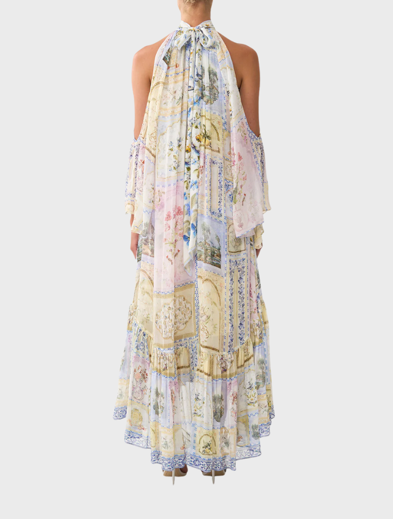 Elegant cold shoulder long dress adorned with a vibrant botanical pattern, ideal for summer gatherings and formal events.