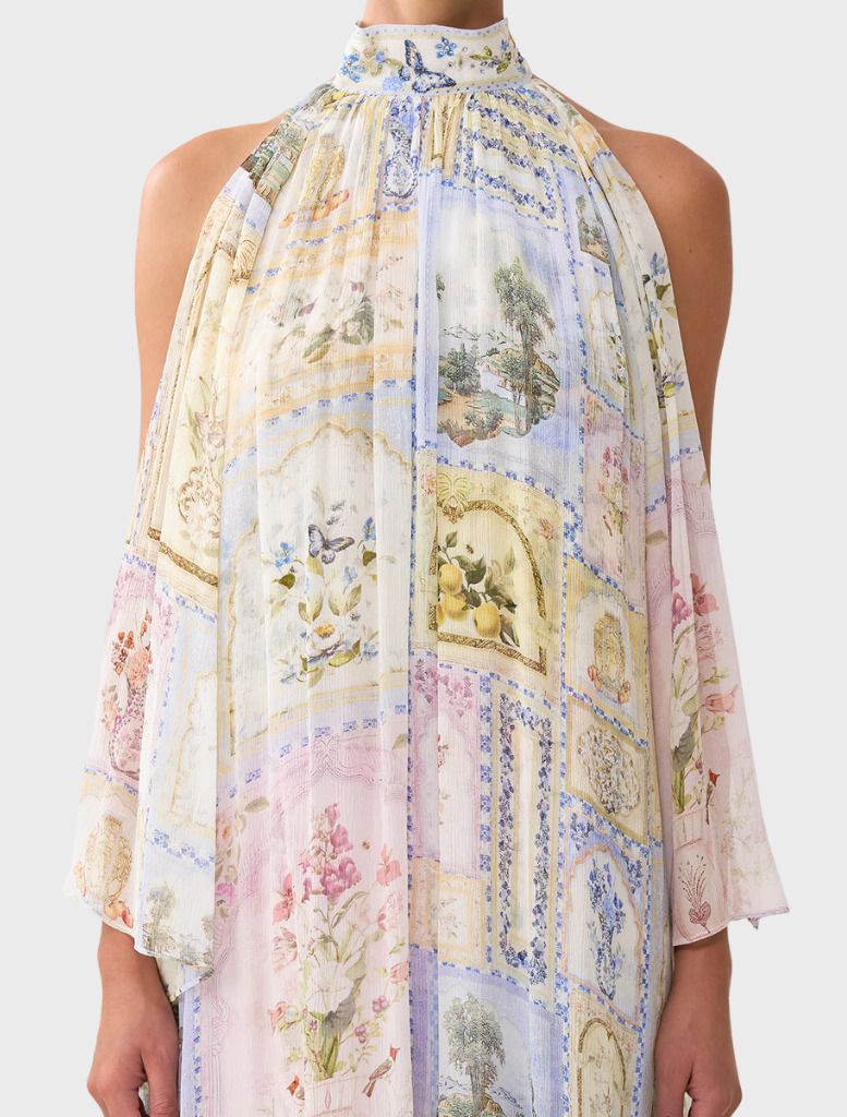 Chic cold shoulder long dress with a colorful botanical motif, perfect for adding flair to any summer wardrobe.