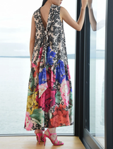 Bow Stopper dress in scattered daisies, showcasing a dip-back design and relaxed fit for effortless elegance.