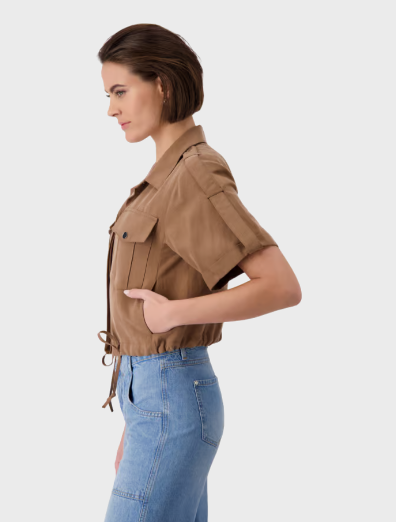 Cropped tan shirt jacket with buttons and pockets, crafted from Lyocell, showcasing a modern collar design.