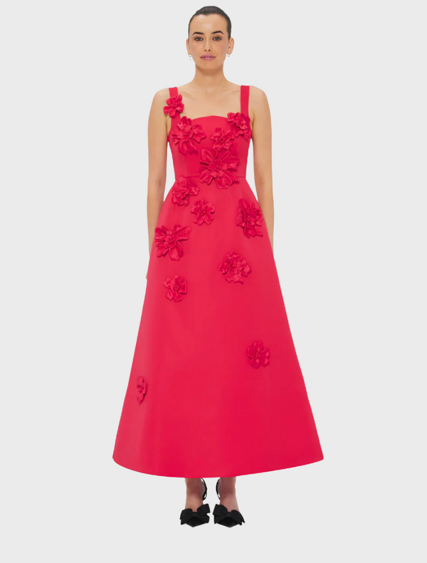 A vibrant red tulle dress, showcasing its delicate and airy fabric.
