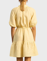 A vibrant solar dress in lemon yellow, featuring a playful lemonade design, perfect for sunny days and casual wear.