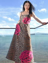 Elegant pleated dress in leopard floral print, featuring boned sides, removable straps, and practical side pockets.