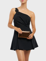A sleek metallic clutch bag crafted from shiny metal, reflecting light with its polished surface.