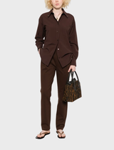 Elegant brown high-waisted wool pants, featuring a tailored fit, displayed against a neutral backdrop
