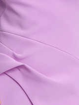 The Burbank Maxi Dress, in vibrant Zinnia Pink, offers a confident, modern look with its structured, architectural design.
