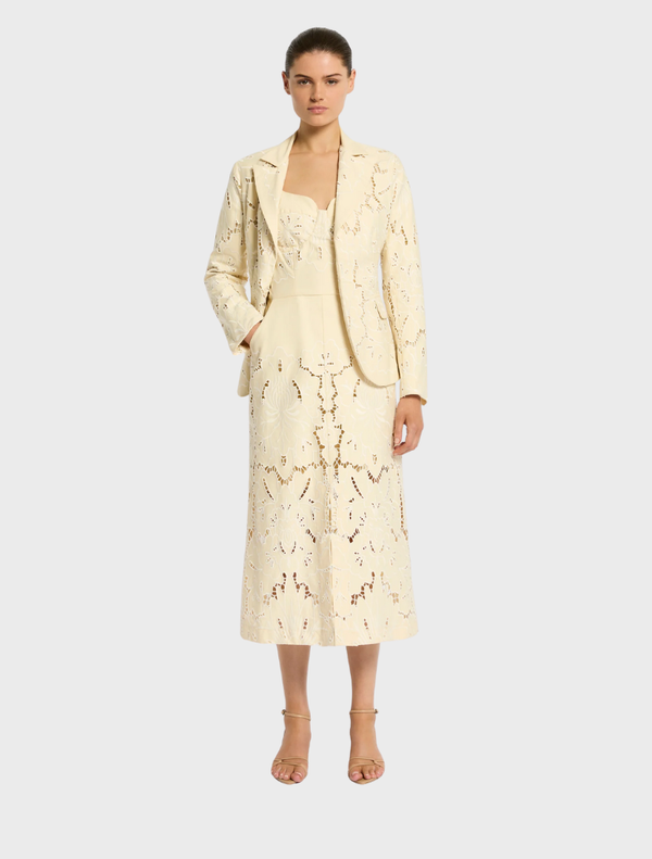 Elegant Colette Dress in a soft Buttermilk shade, showcasing a flattering fit and versatile style for any event.