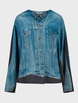 Light blue Cad blouse displayed on a hanger, showcasing its elegant design and fabric texture.