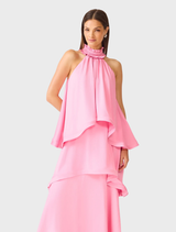 Pink Calista Tiered Gown featuring ruffle neck, halter neckline, and cascading panels for a graceful, elegant silhouette.