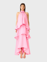 Pink Calista Tiered Gown featuring ruffle neck, halter neckline, and cascading panels for a graceful, elegant silhouette.