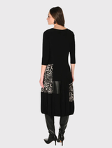 Elegant camel and black A-line midi dress with animal print, round neck, 3/4 sleeves, and pockets for comfort and style.c