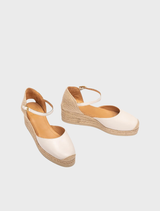 Canelle low wedge espadrille with a jute sole, offering a chic and comfortable option for summer footwear.