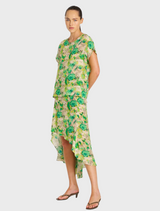 Short dress in green floral print, showcasing a trendy high-low hem for a fashionable summer appearance.