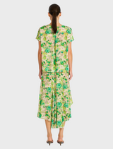 A vibrant green floral dress, short in length with a high-low hem, suitable for both casual and semi-formal events.

