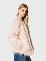 A pink coat displayed on a hanger, showcasing its elegant design and fabric texture.