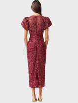 Elegant burgundy dress adorned with sequins, featuring short sleeves for a stylish and festive look.
