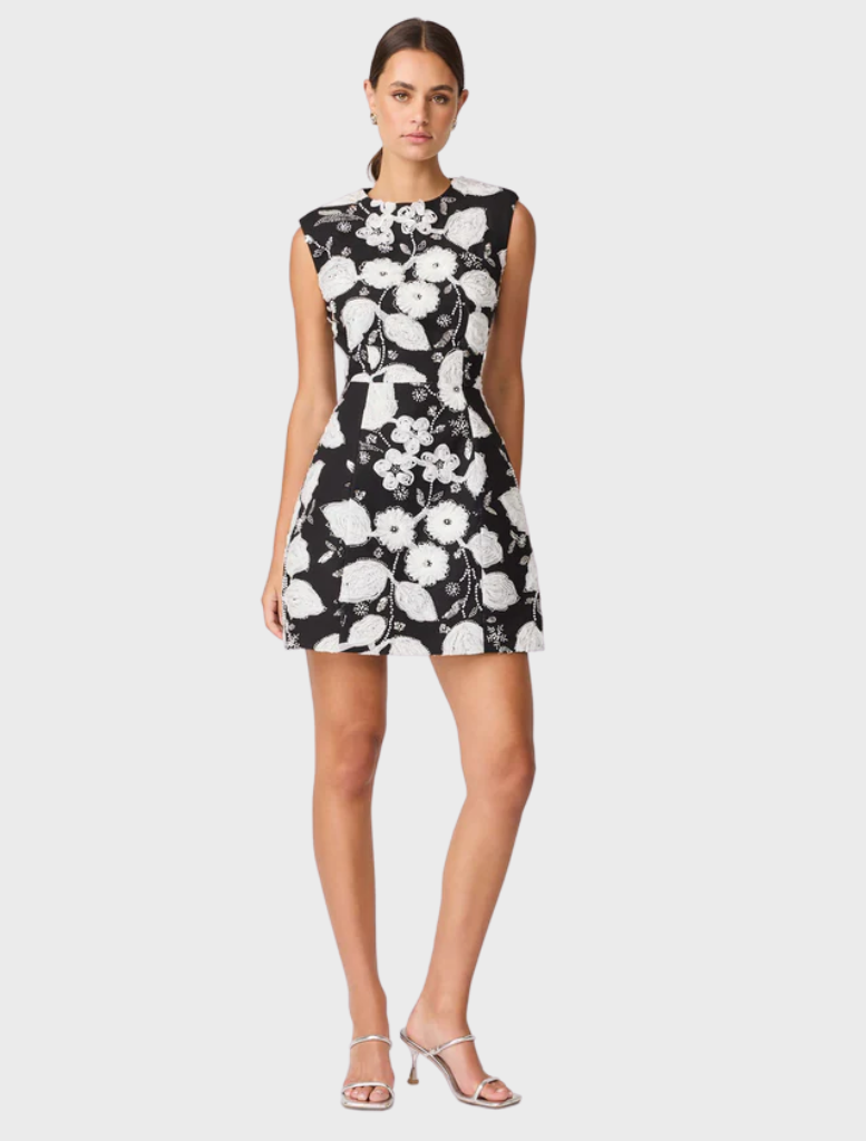 Floral dress in black and white, crafted to visually represent a flower with petal-like details and elegant design.