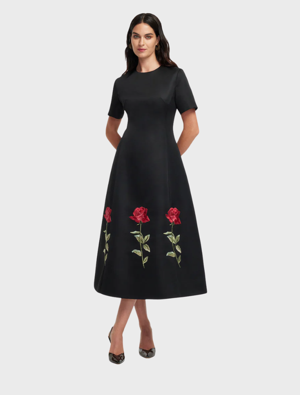  Elegant ebony midi dress adorned with rose embellishments, perfect for formal occasions or special events.
